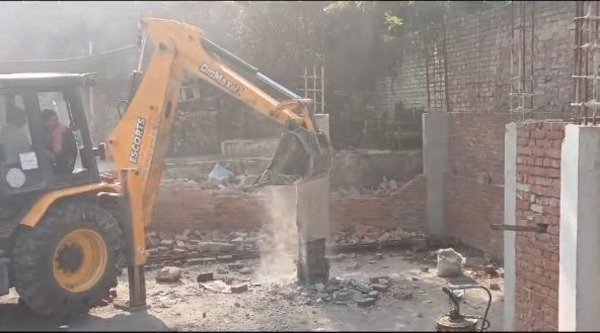 Bulldozer action seen on a building under illegal construction in Fatehpur district of UP.