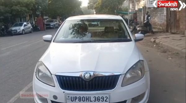 Unique incident in Agra: Car driver wearing helmet continues driving after getting challaned