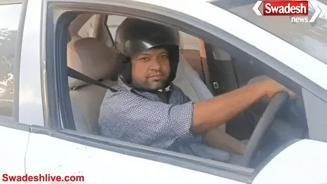 चालान से बचने के लिए हेलमेट पहनकर कार चलाते दिखे शिक्षक, आगरा पुलिस व्यवस्था पर उठे सवाल